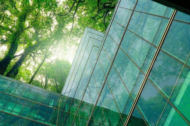 Eco-friendly building in modern city. Sustainable glass office b